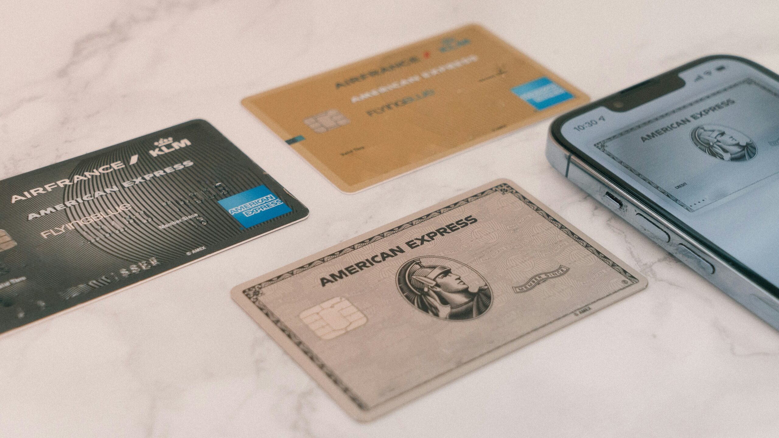 3 different credit cards on a marble countertop